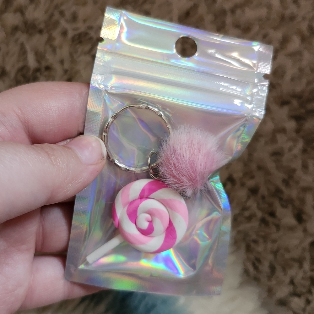 Pink and White Swirl Keychain with Fluffy Pom Pom